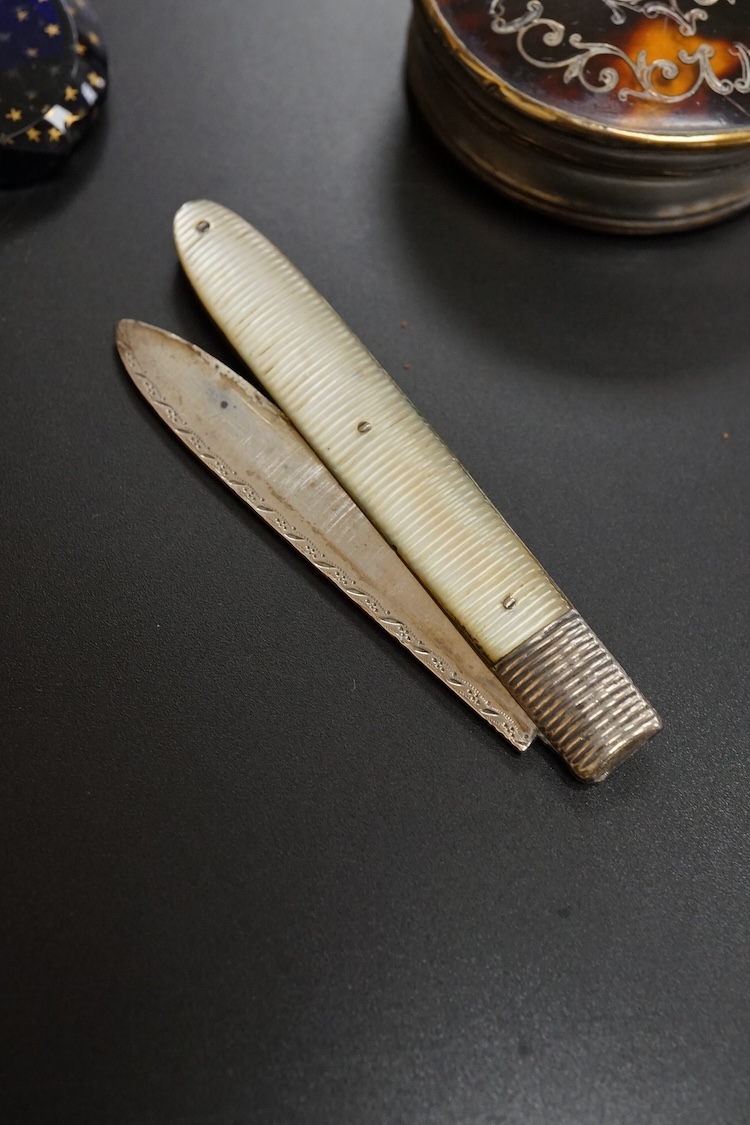 A collection of 19th century and later silver and white metal mounted items comprising three boxes, two glass scent bottles and a folding mother of pearl pen knife, largest 7.5cm high